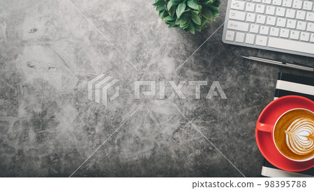 Office desk workplace with keyboard, pen, notebook and cup of coffee, Top view flat lay with copy space. Office desk workplace with keyboard, pen, notebook and cup of coffee, Top view flat lay with copy space. 98395788