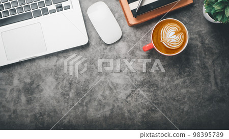 Office desk workplace with laptop, mouse, pen, note and cup of coffee, Top view flat lay with copy space. 98395789