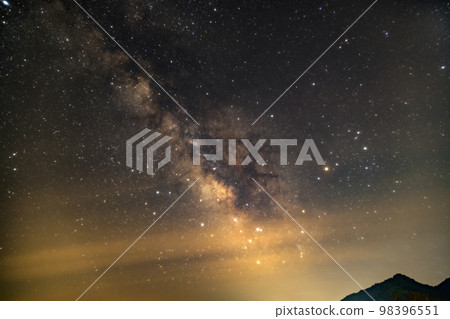The starry sky in early summer, the Milky Way hazy in thin clouds 98396551
