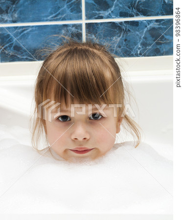 Portrait of pretty little girl in bath. Hygiene concept. 98396864