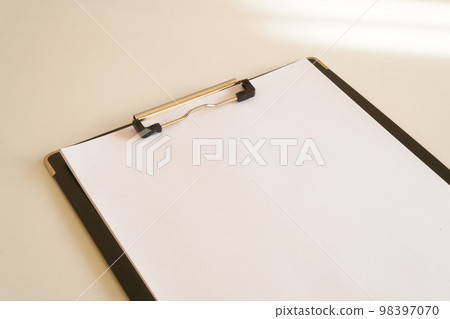 white paper on clipboard 98397070