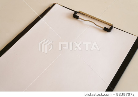 white paper on clipboard 98397072