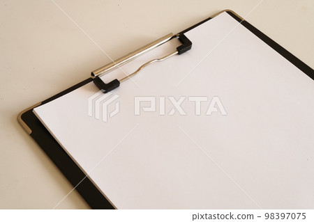 white paper on clipboard 98397075