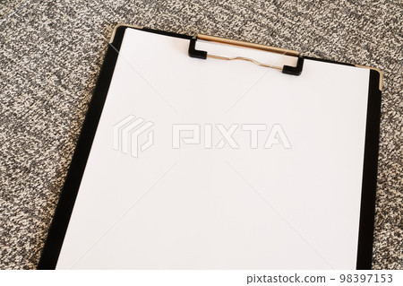 white paper on clipboard 98397153
