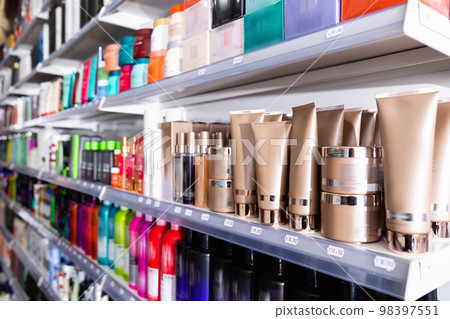 Colorful showcase in cosmetic boutique with variety of hair care treatments 98397551