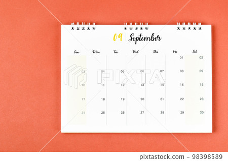 The September 2023 calendar desk for the organizer to plan and reminder on red background. The September 2023 calendar desk for the organizer to plan and reminder on red background. 98398589