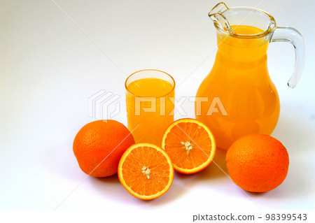 Jug and glass of orange juice and ripe oranges isolated on white background. Healthy nutrition concept 98399543