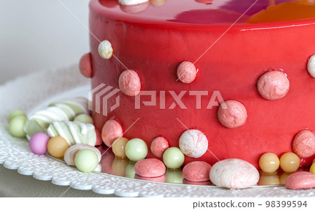 Homemade red birthday cake with air baloons Homemade red birthday cake with air baloons 98399594