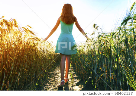 Beauty young girl outdoors enjoying nature. Beautiful teenage mo 98402137