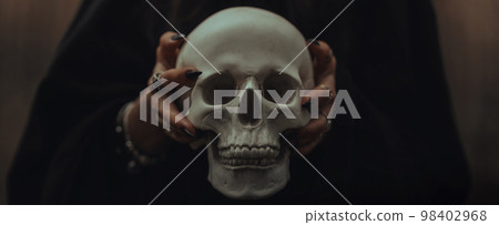 skull of a dead man in the hands of a witch witch skull of a dead man in the hands of a witch witch 98402968