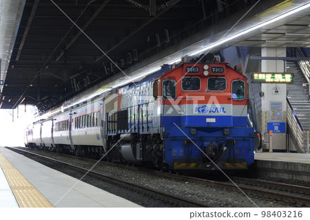 Mugunghwa, a high-class train of Korea Railroad Corporation KORAIL, pulled by a diesel locomotive 98403216