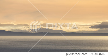 Vancouver Island Covered in Clouds during winter sunset. Vancouver Island Covered in Clouds during winter sunset. 98403602
