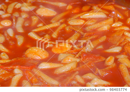 Tteokbokki, a typical Korean street food dish made with sweet and salty rice cakes Tteokbokki, a typical Korean street food dish made with sweet and salty rice cakes 98403774