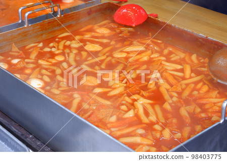 Tteokbokki, a typical Korean street food dish made with sweet and salty rice cakes 98403775