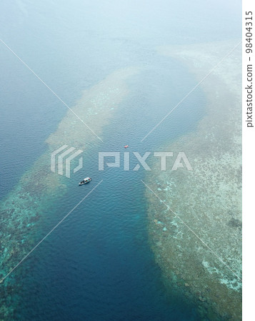 Manta ray drone view at Manta road in Pohnpei, Micronesia. You can meet them by scuba diving. 98404315