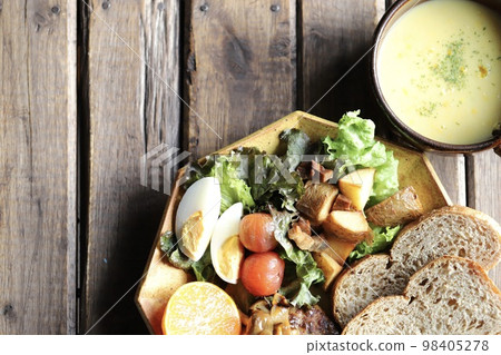 Rye bread and plenty of vegetables on a plate Rye bread and plenty of vegetables on a plate 98405278