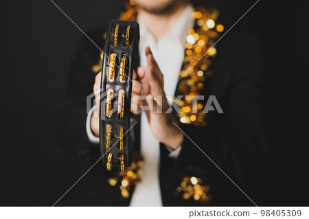 man with tambourine 98405309