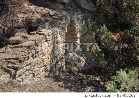 Old Small bridge aqueduct in mountain. More than hundred years ago it was held Golitsyn plumbing. Crimea Old Small bridge aqueduct in mountain. More than hundred years ago it was held Golitsyn plumbing. Crimea 98406262