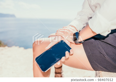 Woman sea laptop. Business woman in yellow hat freelancer with laptop working over blue sea beach. Girl relieves stress from work. Freelance, digital nomad, travel and holidays concept Woman sea laptop. Business woman in yellow hat freelancer with laptop working over blue sea beach. Girl relieves stress from work. Freelance, digital nomad, travel and holidays concept 98407012