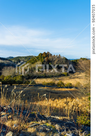 Evening view of the Nunome Dam in Nara.The sky over the downstream of the dam lake beyond the withered Japanese pampas grass (3) Evening view of the Nunome Dam in Nara.The sky over the downstream of the dam lake beyond the withered Japanese pampas grass (3) 98407035