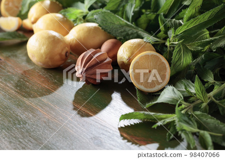 Fresh juicy lemons with mint. Fresh juicy lemons with mint. 98407066