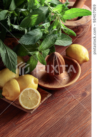 Fresh juicy lemons with mint. Fresh juicy lemons with mint. 98407069