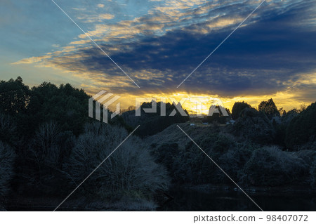 Evening view of Nunome Dam in Nara Magnificent clouds appearing in the sunset sky across the dam lake Evening view of Nunome Dam in Nara Magnificent clouds appearing in the sunset sky across the dam lake 98407072
