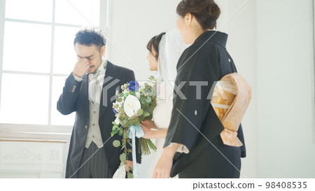 Parents crying with joy at their daughter's marriage Parents crying with joy at their daughter's marriage 98408535