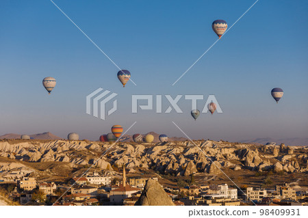 Goreme, Turkey - Mountain landscape with hot air balloons in Goreme, Cappadocia, Turkey 98409931