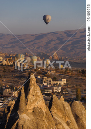 Goreme, Turkey - Mountain landscape with hot air balloons in Goreme, Cappadocia, Turkey 98409966