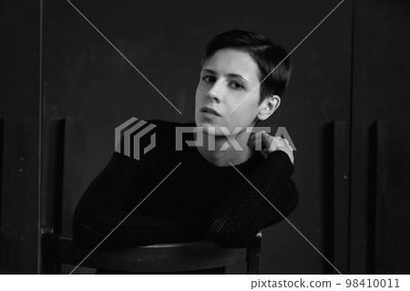 Portrait of a girl on black . Portrait of a girl on black . 98410011
