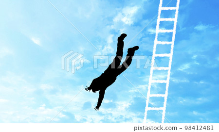 Silhouette of a person falling from a ladder_blue sky background wide Silhouette of a person falling from a ladder_blue sky background wide 98412481