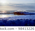 A man who surfs 98413226