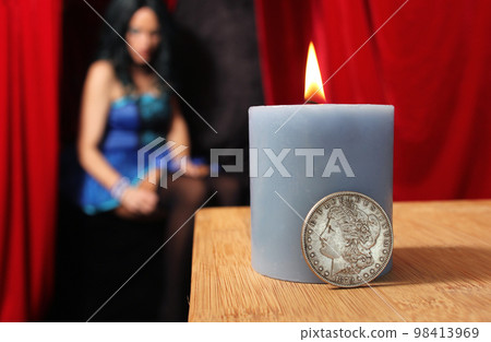 1879 Morgan Silver Coin With Woman in Blue Corset in Background Shallow DOF 1879 Morgan Silver Coin With Woman in Blue Corset in Background Shallow DOF 98413969