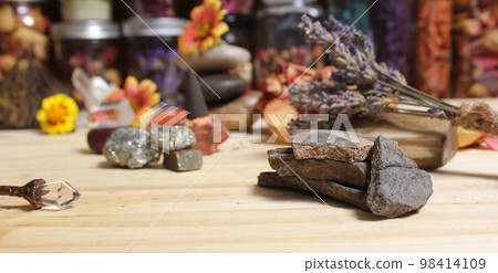 Ancient Native American Pottery Pieces With Crystals and Flowers on Meditation Table 98414109