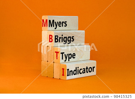 MBTI Myers Briggs type indicator symbol. Concept words MBTI Myers Briggs type indicator on block on beautiful orange background. Psychological MBTI Myers Briggs type indicator concept. Copy space 98415325