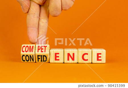 Competence and confidence symbol. Concept word Competence Confidence on wooden cubes. Businessman hand. Beautiful orange table orange background. Business competence confidence concept. Copy space. Competence and confidence symbol. Concept word Competence Confidence on wooden cubes. Businessman hand. Beautiful orange table orange background. Business competence confidence concept. Copy space. 98415399