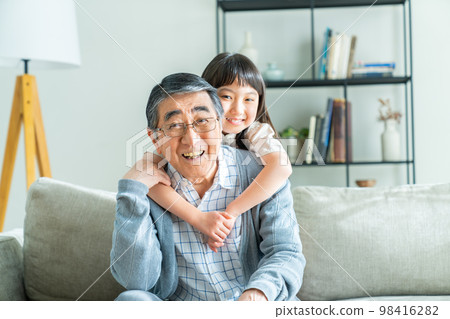 Good friends grandpa and grandson in the living room 98416282