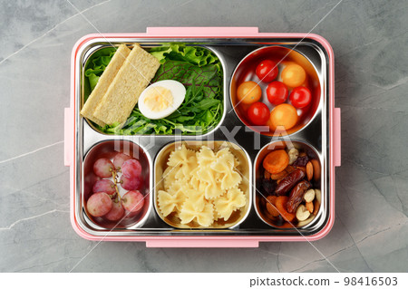 Lunch box with ready food on gray background 98416503
