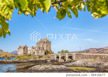 Spring trees against Eilean Donan Castle at Kyle of Lochalsh in the Western Highlands of Scotland Spring trees against Eilean Donan Castle at Kyle of Lochalsh in the Western Highlands of Scotland 98416677