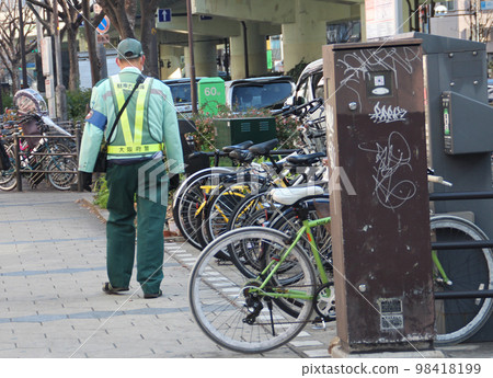 Parking warden who cracks down on parking violations 98418199