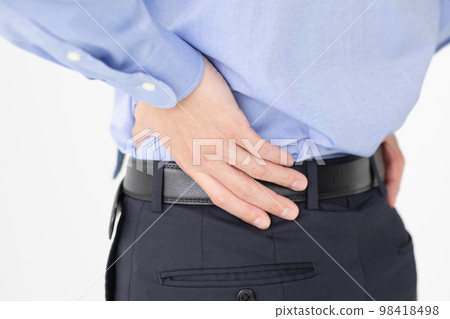 Businessman low back pain Businessman low back pain 98418498