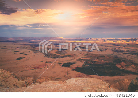 Beautiful dramatic sunset over the desert. Nature landscape. Makhtesh Ramon Crater, Israel Beautiful dramatic sunset over the desert. Nature landscape. Makhtesh Ramon Crater, Israel 98421349