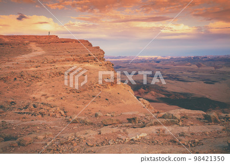 Beautiful dramatic sunset over the desert. Nature landscape. Makhtesh Ramon Crater, Israel Beautiful dramatic sunset over the desert. Nature landscape. Makhtesh Ramon Crater, Israel 98421350
