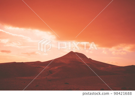 Mountainous desert with dramatic evening cloudy sky at sunset. The Judean Desert in Israel 98421688