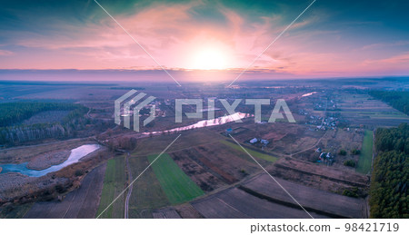 Magical sunset in the countryside in autumn. Rural landscape in the evening 98421719