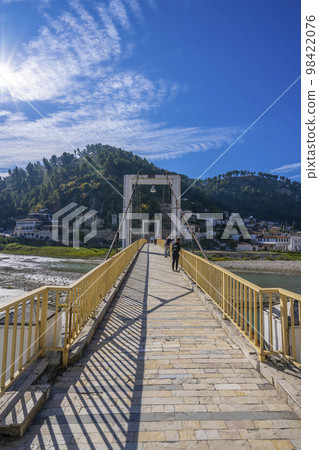View to Berat, historic city in the south of Albania at night with all lights flashing and white houses gathering on a hill. Captured during blue hour with the sky full of stars. 98422076