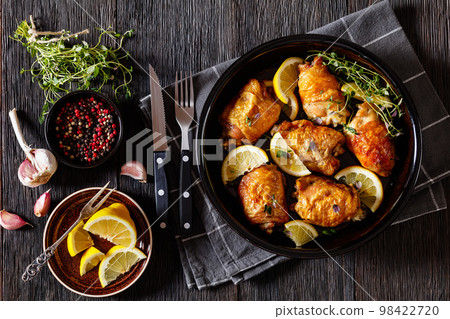 roast chicken thighs with lemon, thyme and spices roast chicken thighs with lemon, thyme and spices 98422720