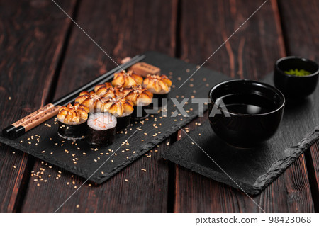 Japanese hot maki roll sushi with shrimp top view - asian food concept Japanese hot maki roll sushi with shrimp top view - asian food concept 98423068