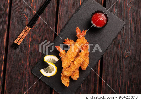 Fried Shrimps tempura with sweet chili sauce - asian japanese food top view Fried Shrimps tempura with sweet chili sauce - asian japanese food top view 98423078